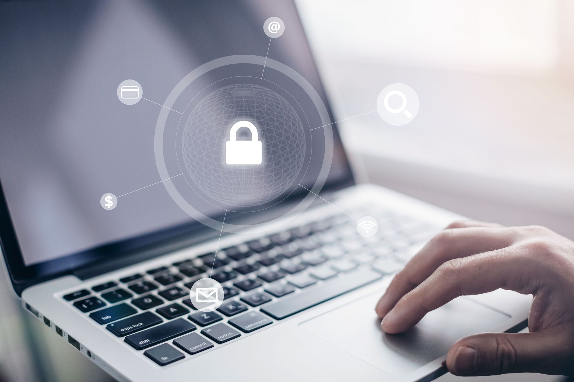 A hand rests on a laptop keyboard with a digital overlay of a padlock icon and security symbols.