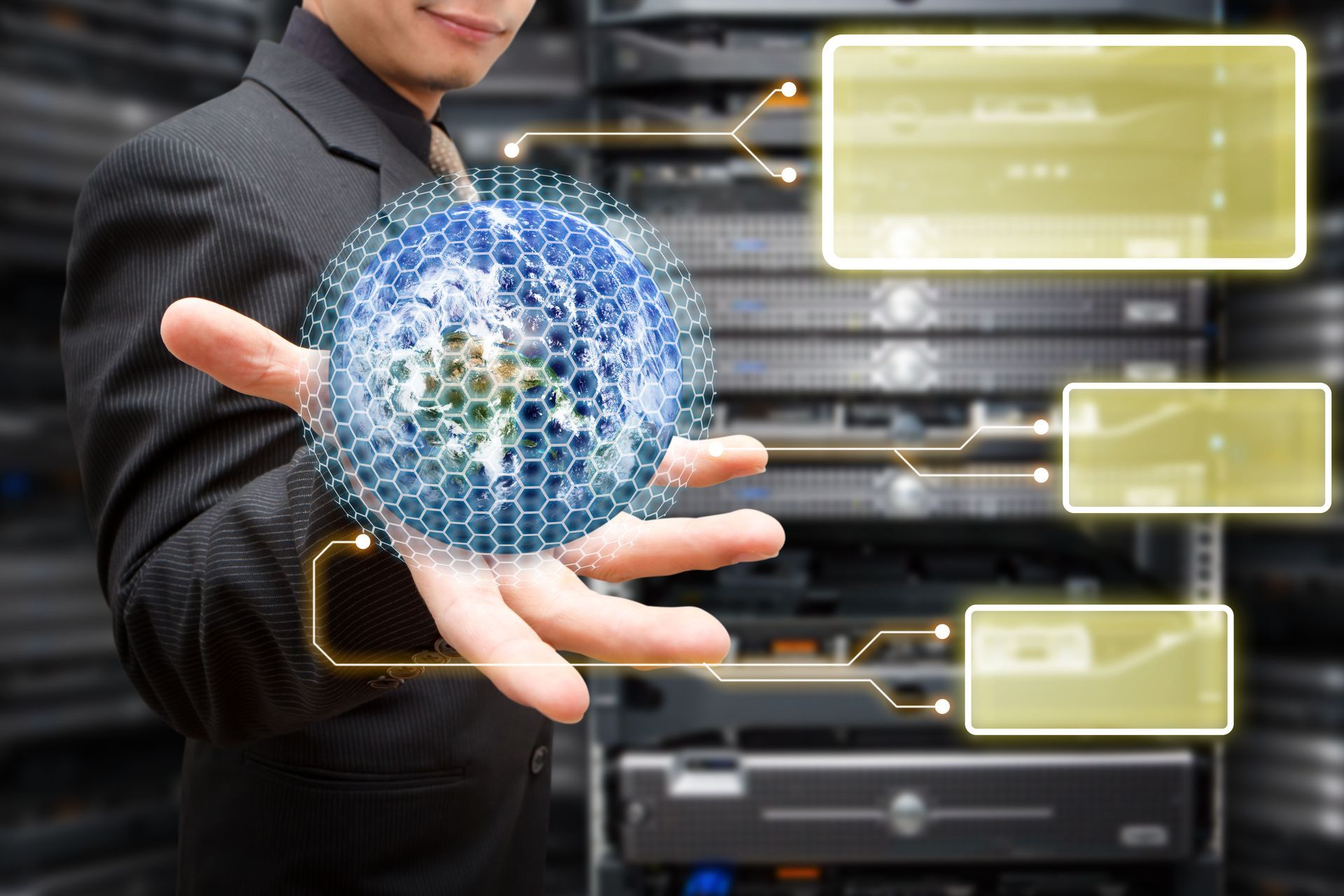 A professional in a suit holds a digital, hexagonal globe in front of server racks with three blank yellow information boxes.