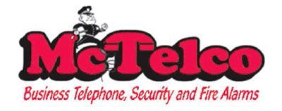 A logo with the red text "McTelco" featuring a cartoon security officer above it, with the subtitle "Business Telephone..."