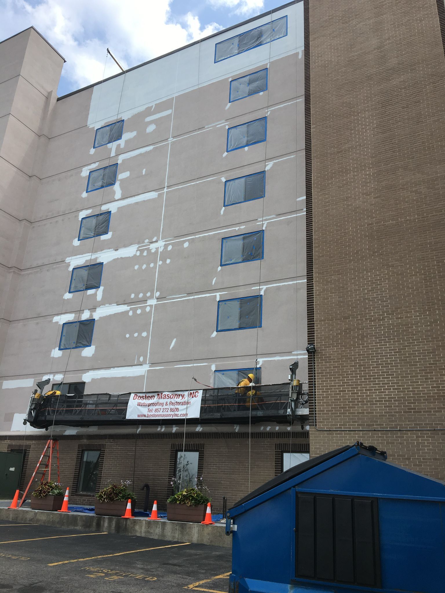 A large concrete building is being restored