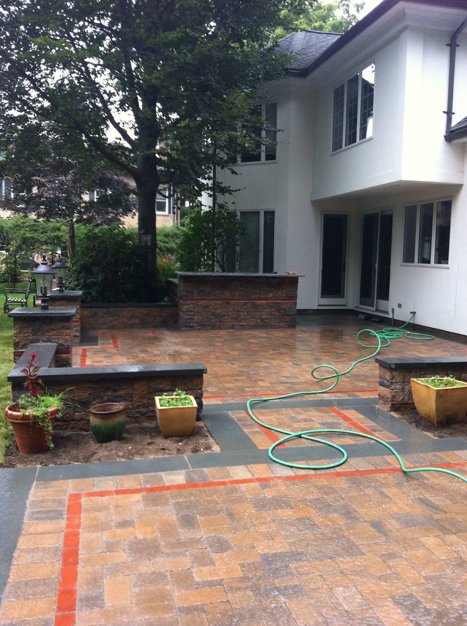 A large white house with a patio in front of it