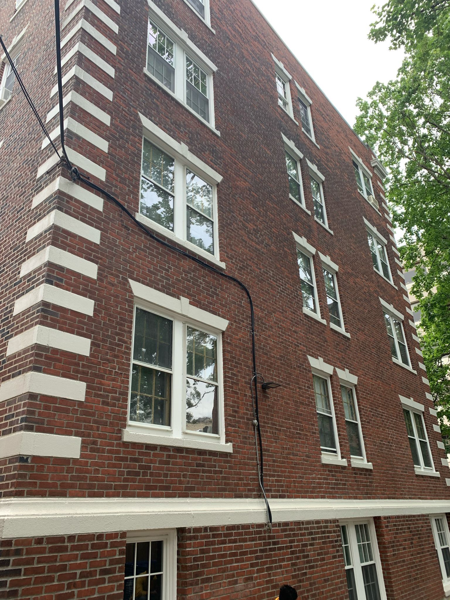 A large brick building with a lot of windows