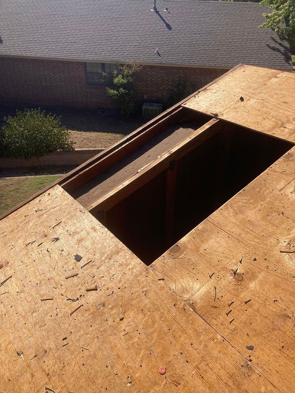 A wooden roof with a hole in the middle of it