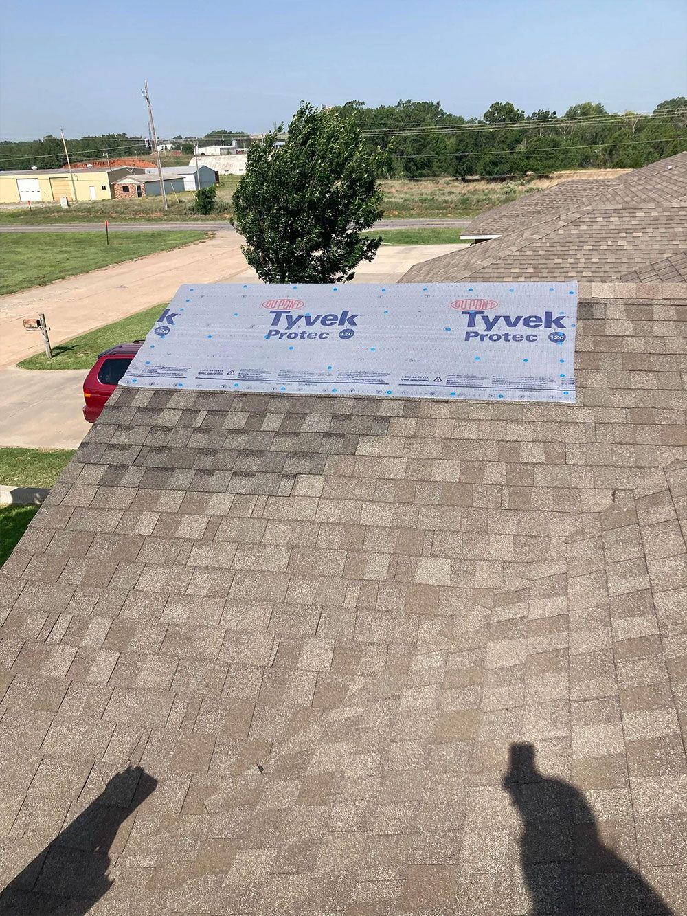 A roof with a tarp on top of it.