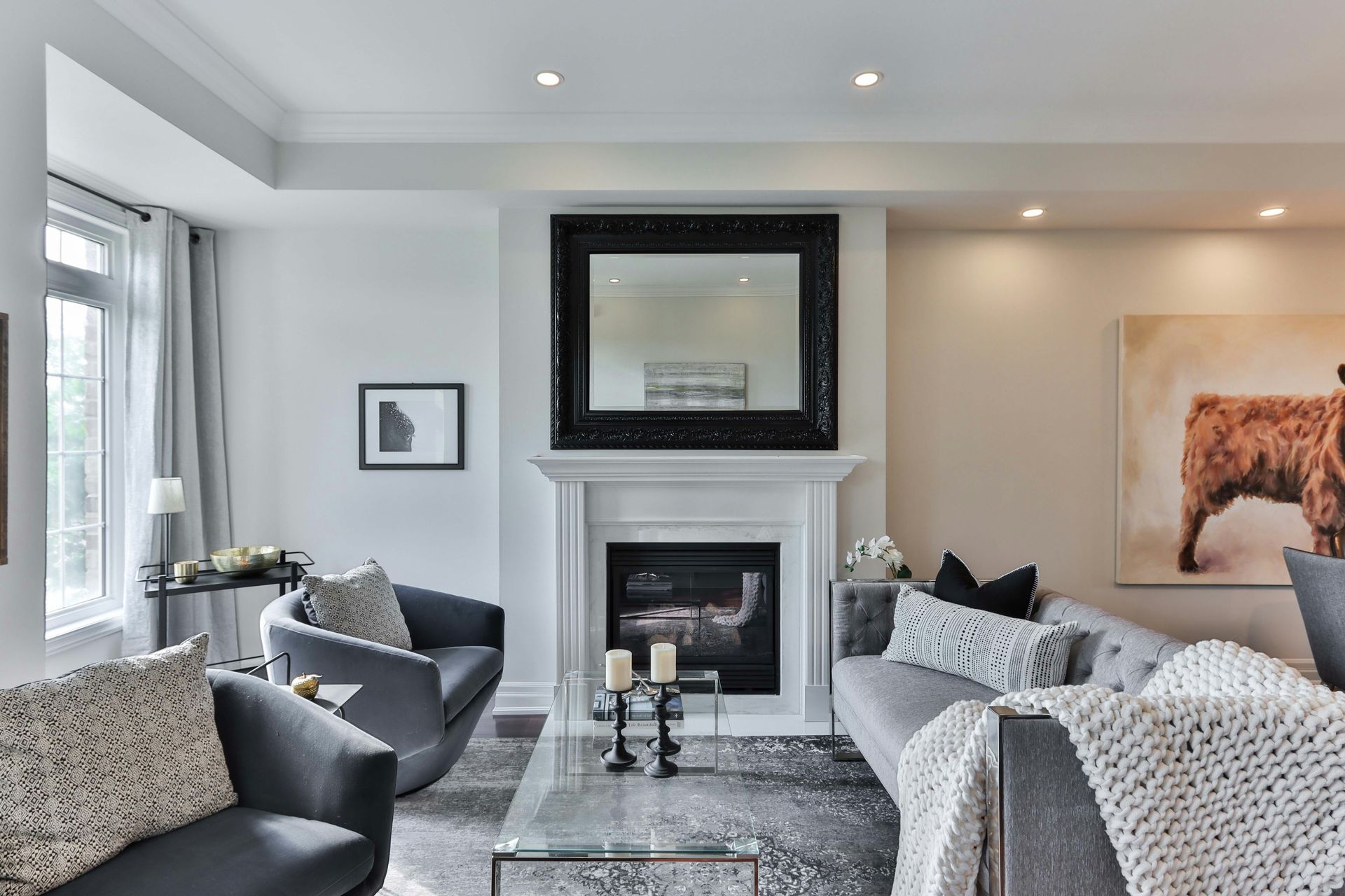 a living room filled with furniture and a fireplace