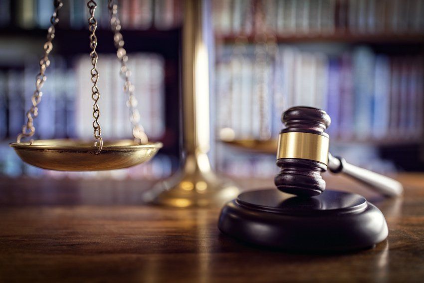 Scales of justice and law books in court