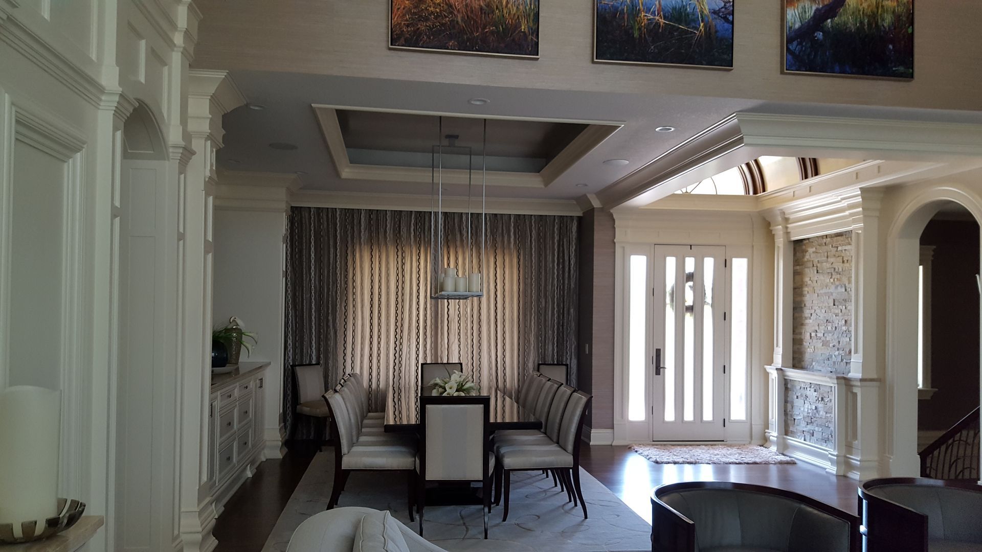 There is a dining room table and chairs in the middle of the room.