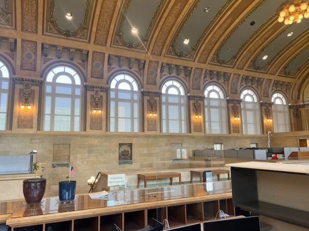 A large room with a lot of windows and a ceiling