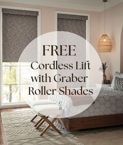 Bedroom with beige roller shades and overlaid text: FREE Cordless Lift with Graber Roller Shades