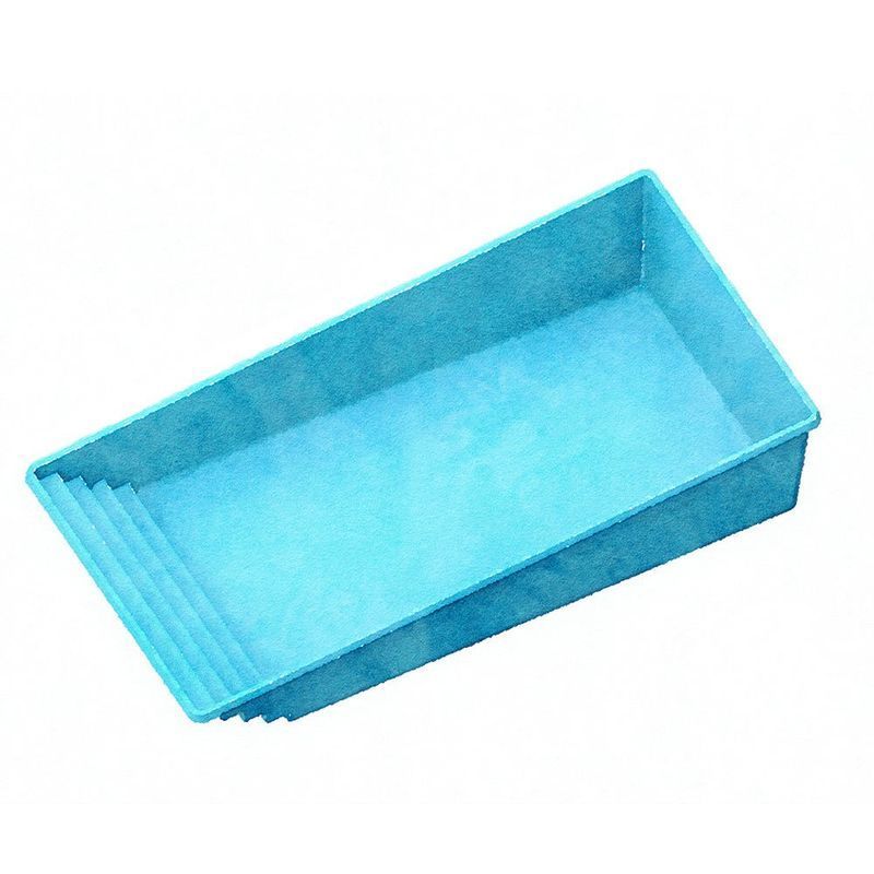 Blue plastic rectangular tray with angled grooves on one end.