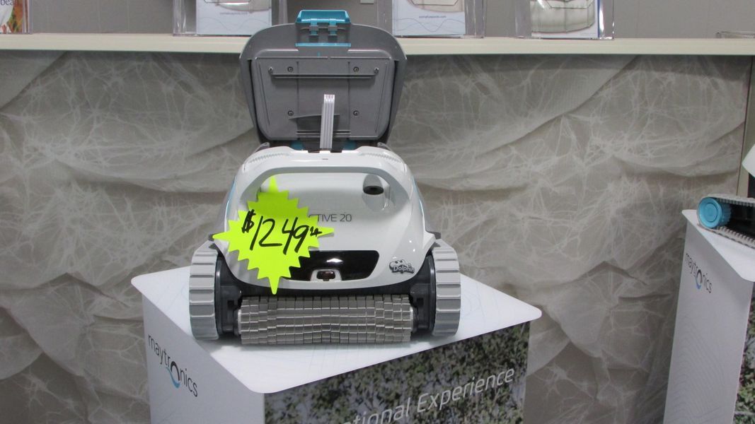 Pool cleaner on display with a $124.99 price tag.
