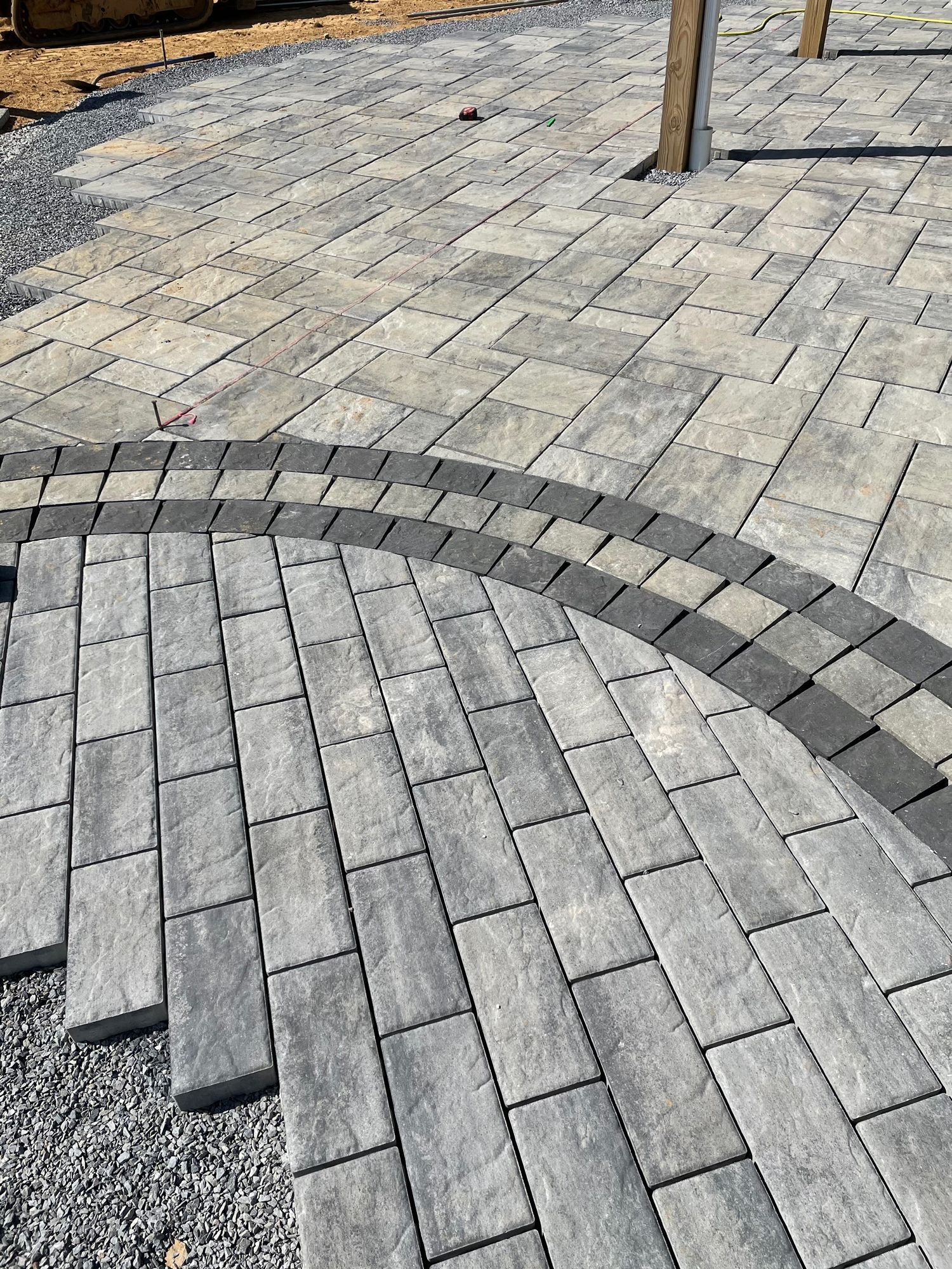 A close up of a brick walkway with a circle in the middle.