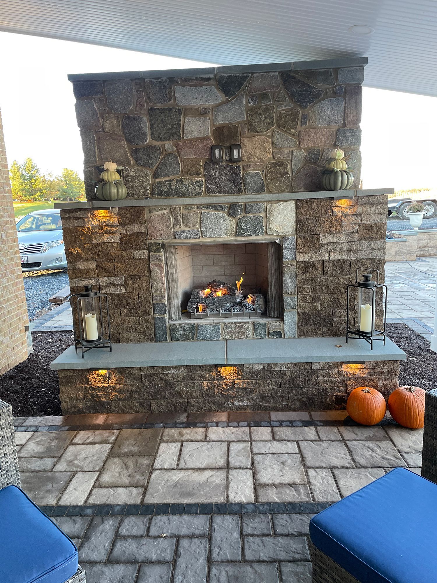 There is a fireplace in the middle of the patio.