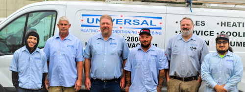 Six uniformed workers standing in front of a Universal Services van.