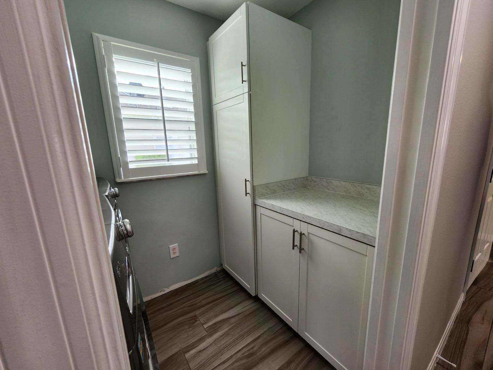 A laundry room with a washer and dryer