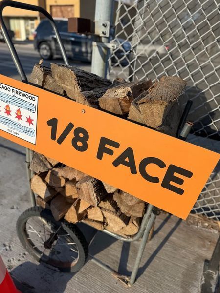 Cart of firewood with sign 