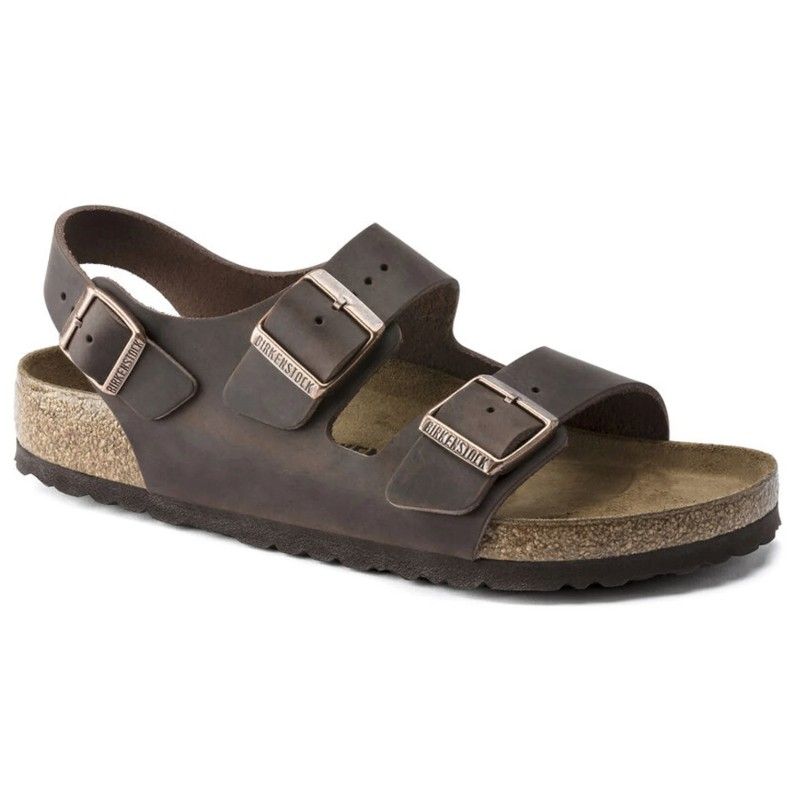 A pair of brown birkenstock sandals on a white background