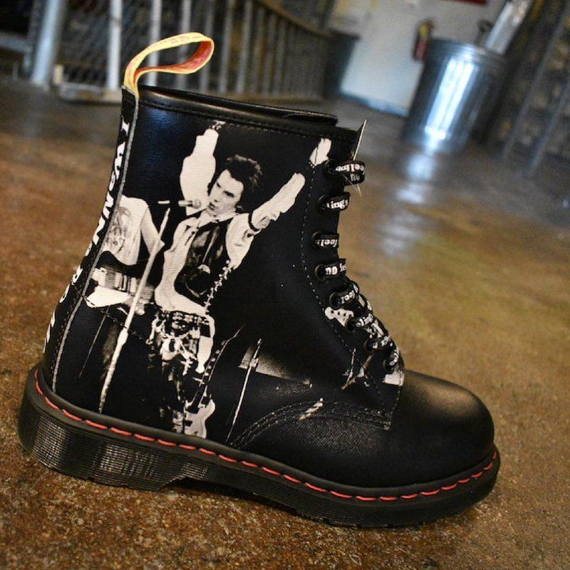 A black boot with a picture of a man on it