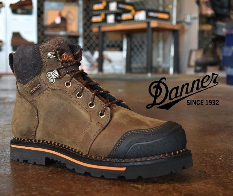 A pair of danner boots on display in a store