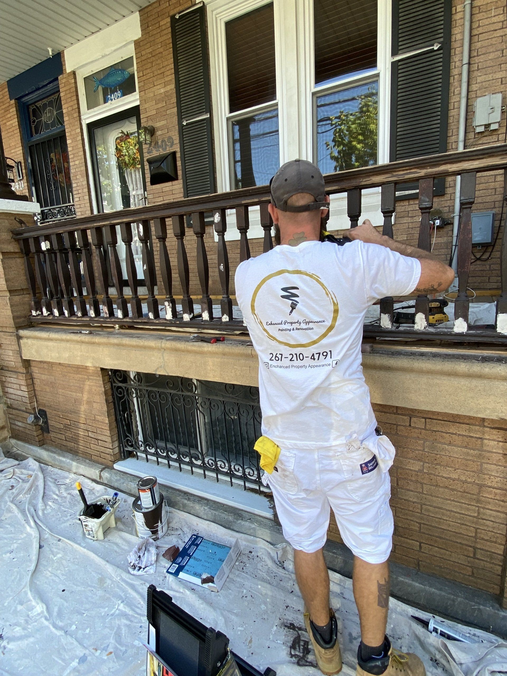 a guy doing exterior painting work