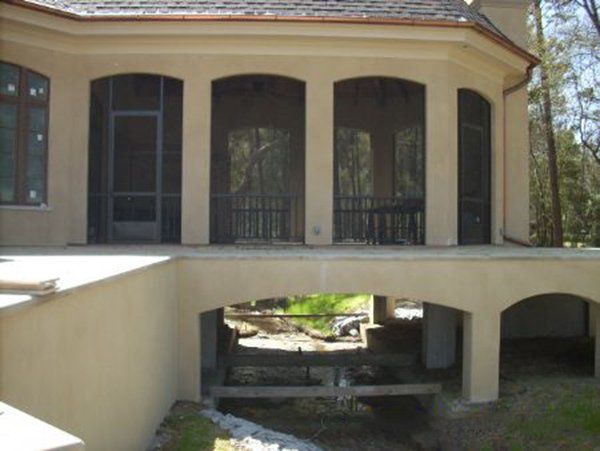 Arch enclosure with bronze rail and pickets