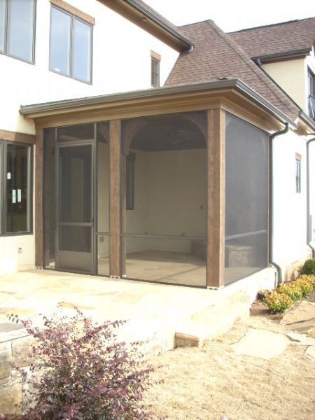 Small porch with brackets and 8 ft door