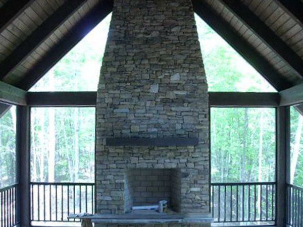 Enclosure with rail and pickets and bronze fiberglass screen