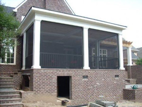 White square columns with bronze aluminum framing