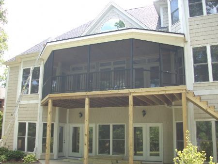 All bronze aluminum enclosure with rail and pickets and 3x3 structural posts