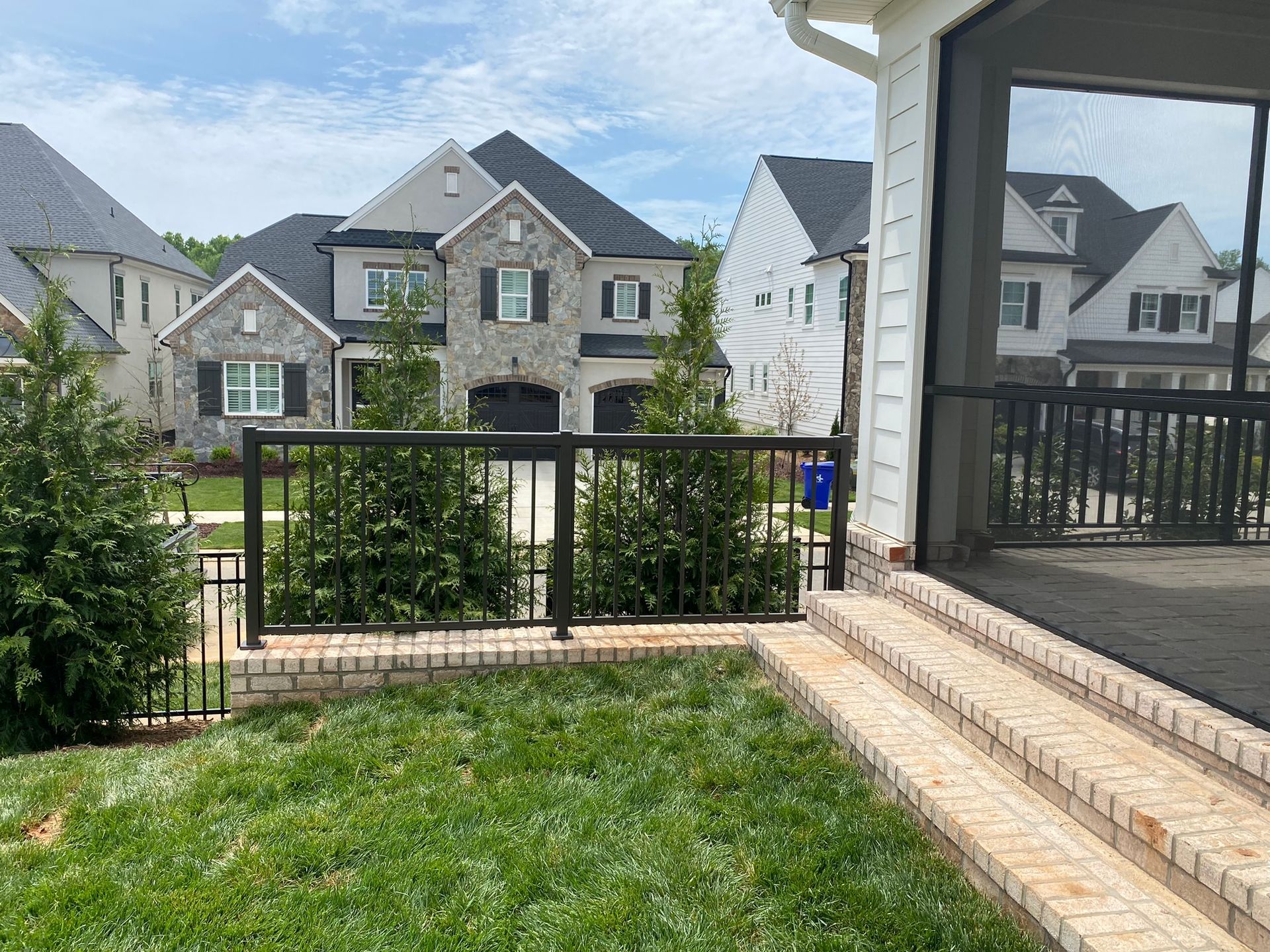 There is a screened in porch in the backyard of a house