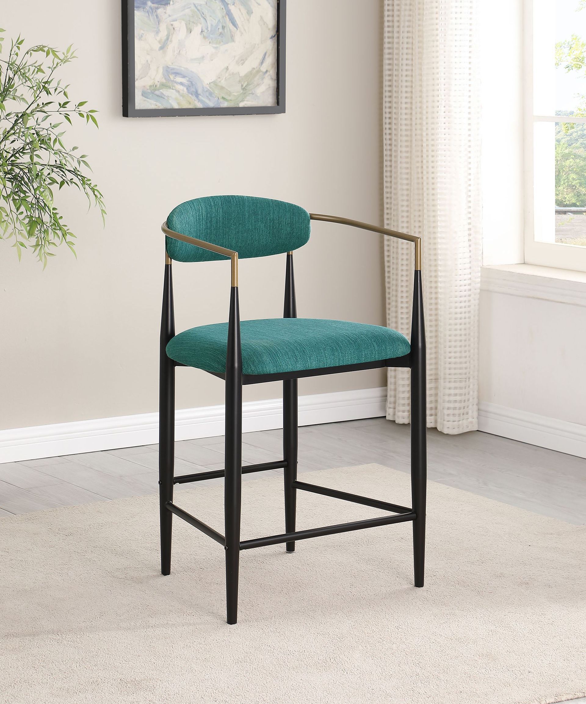 A green bar stool is sitting on a white rug in a living room.