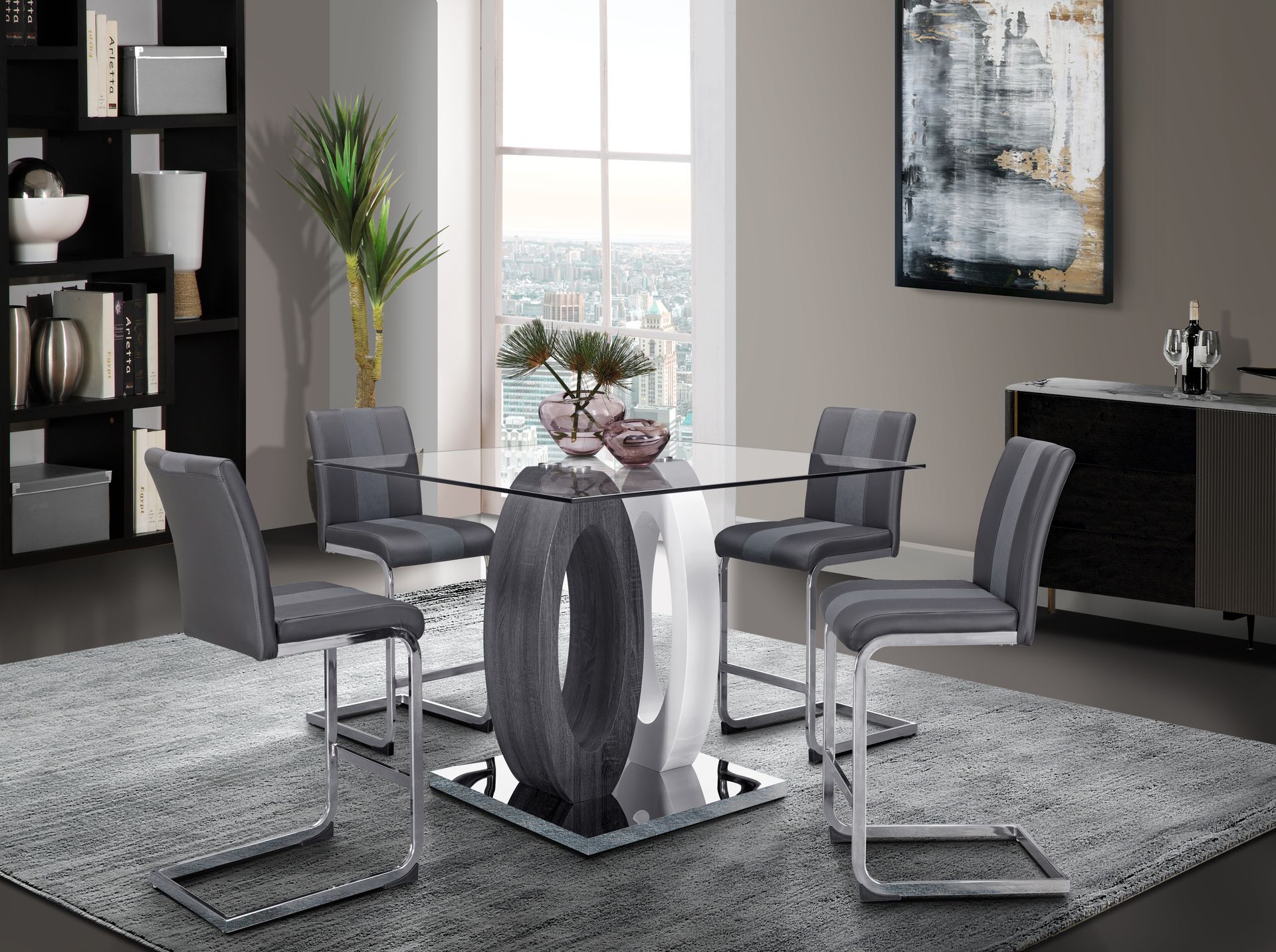 A dining room with a table and chairs and a rug.