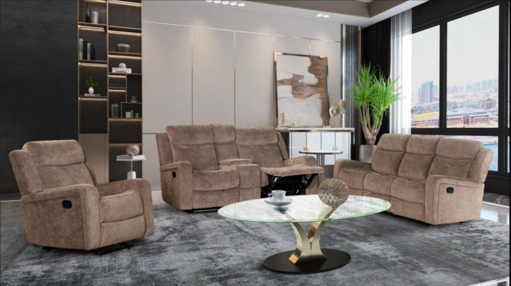 A living room with a couch , two chairs , and a coffee table.