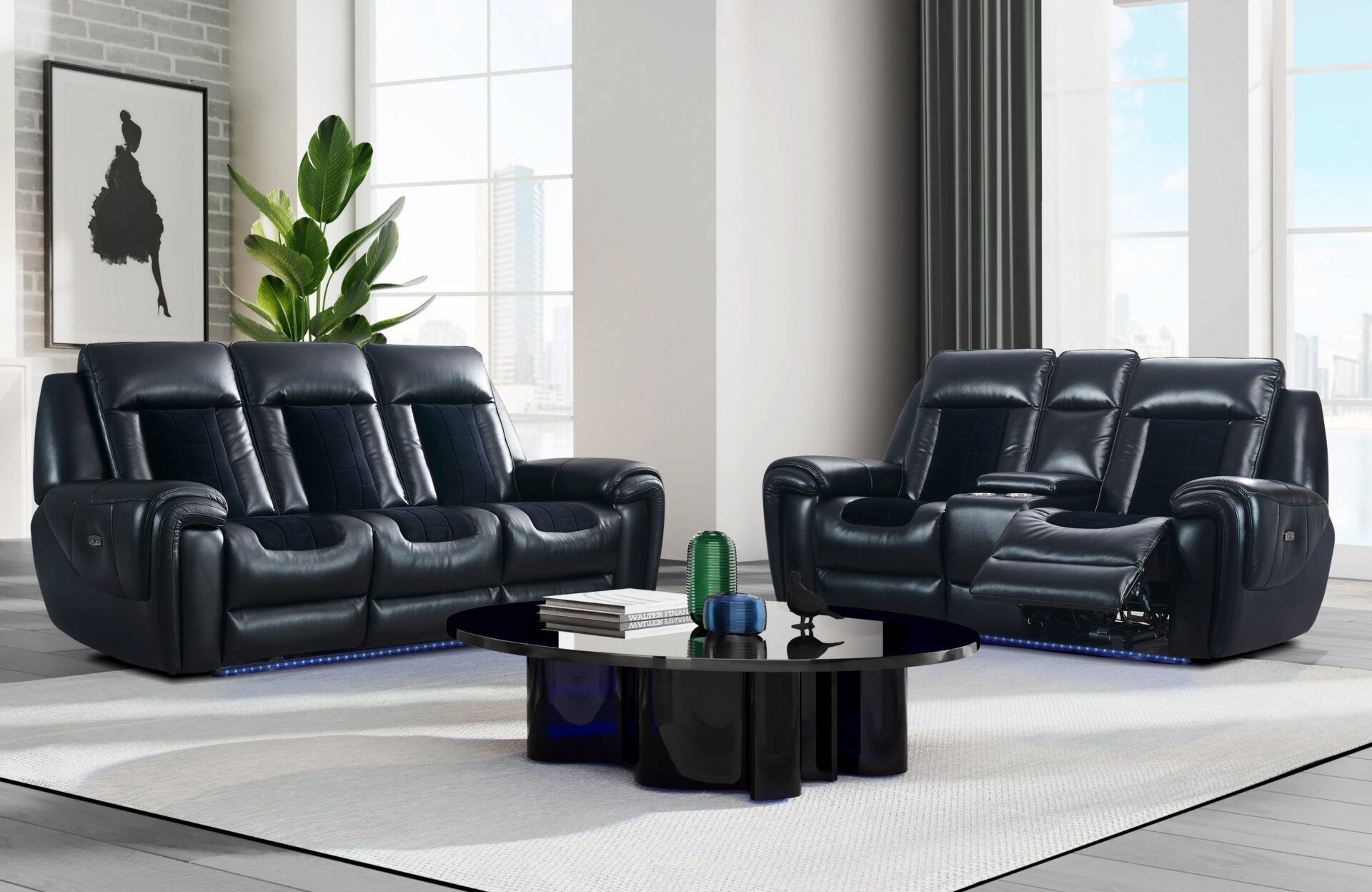A living room with two black leather reclining couches and a black coffee table.