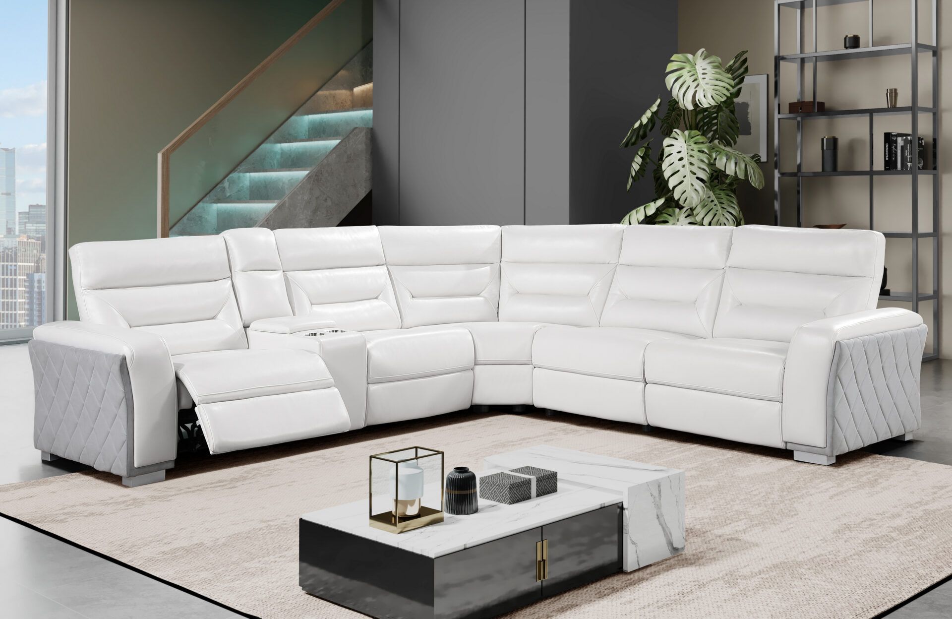 A living room with a white sectional couch and a coffee table.