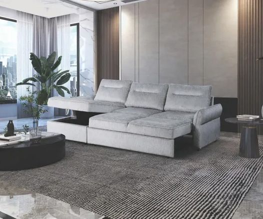 A living room with a white sectional couch and a coffee table