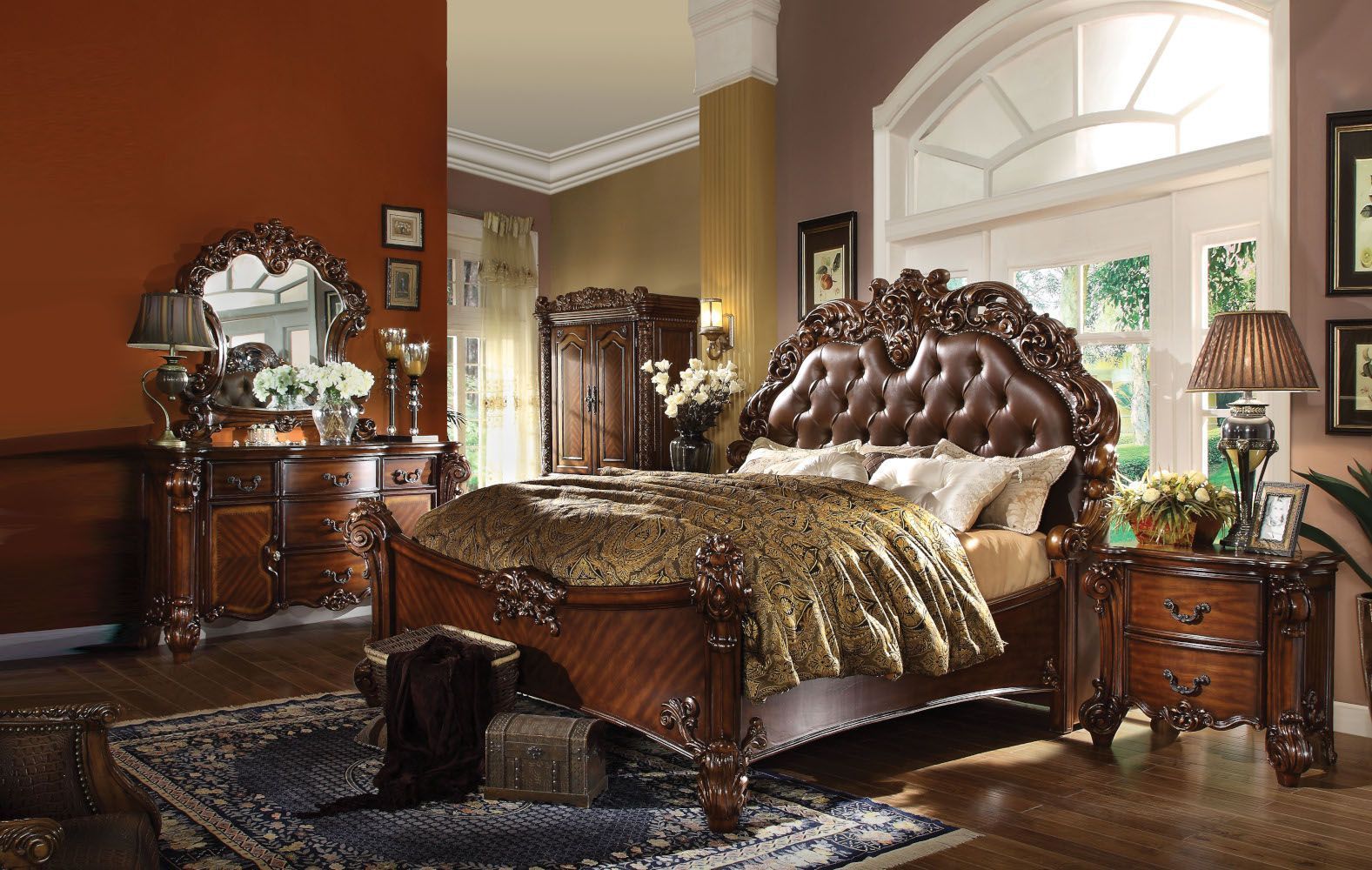 A bedroom with a bed dresser mirror and nightstand