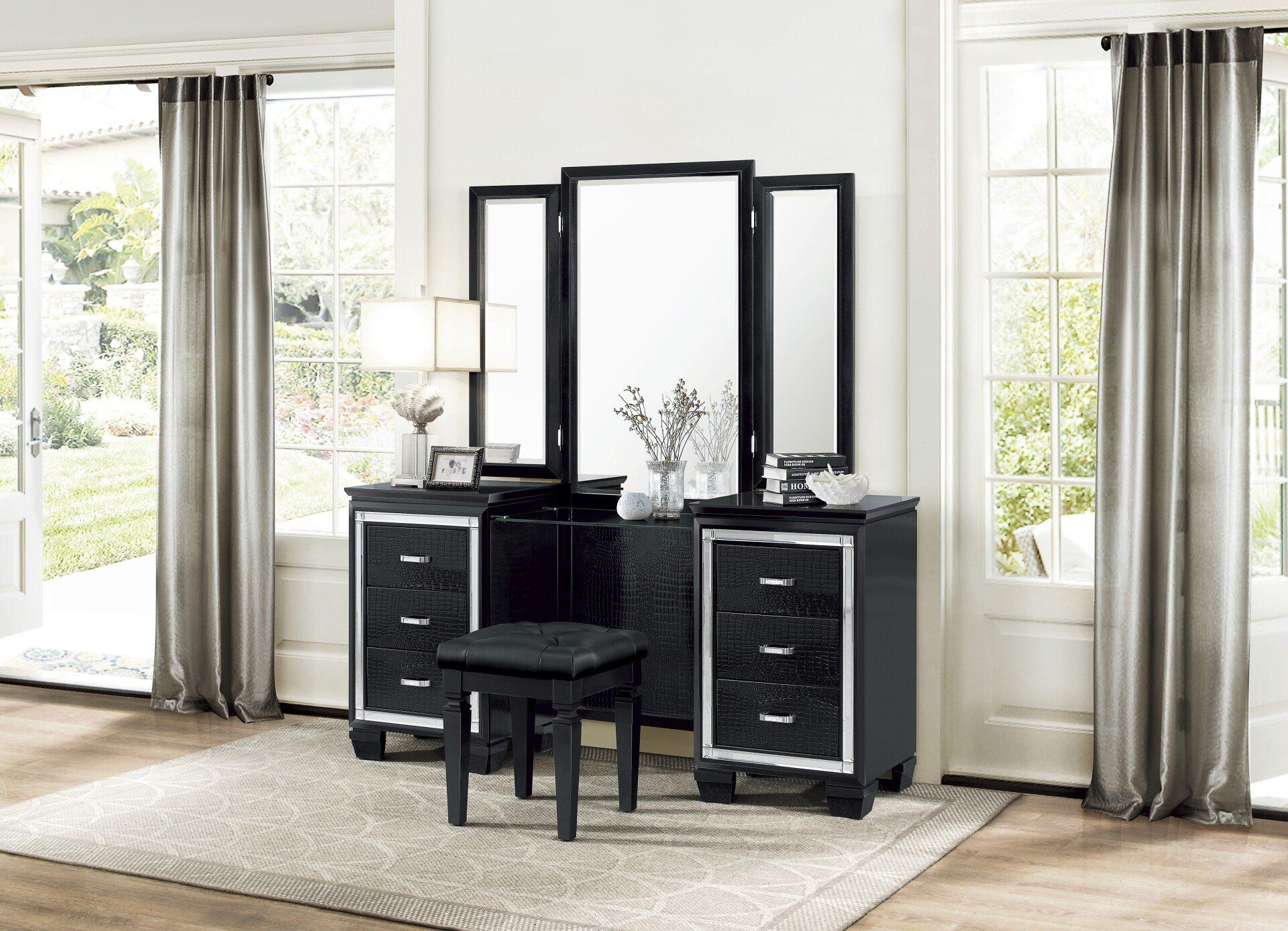 A bedroom with a vanity , mirror and stool.
