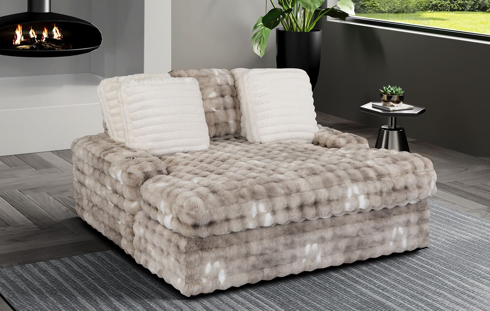 A large couch is sitting in a living room next to a fireplace.