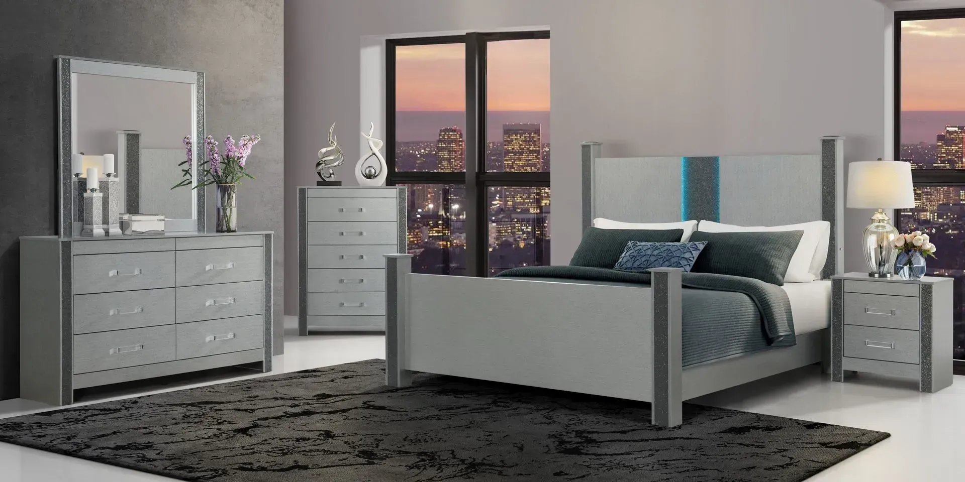 Bedroom set with a bed, dresser, nightstand, and mirror in a gray room with a dark rug.