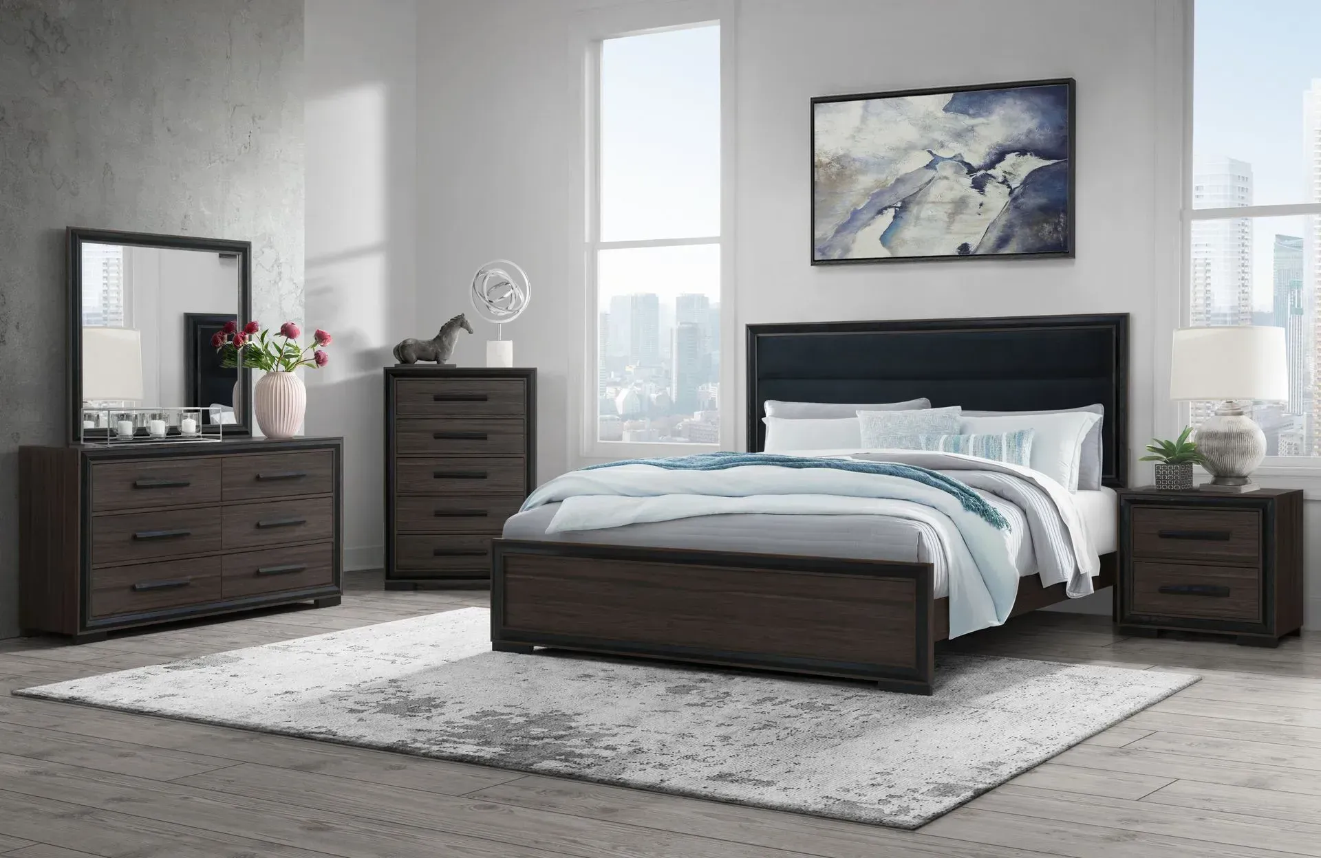 Bedroom set with dark brown furniture on a gray rug and walls. Bed, dresser, mirror, chest of drawers, and nightstand visible.
