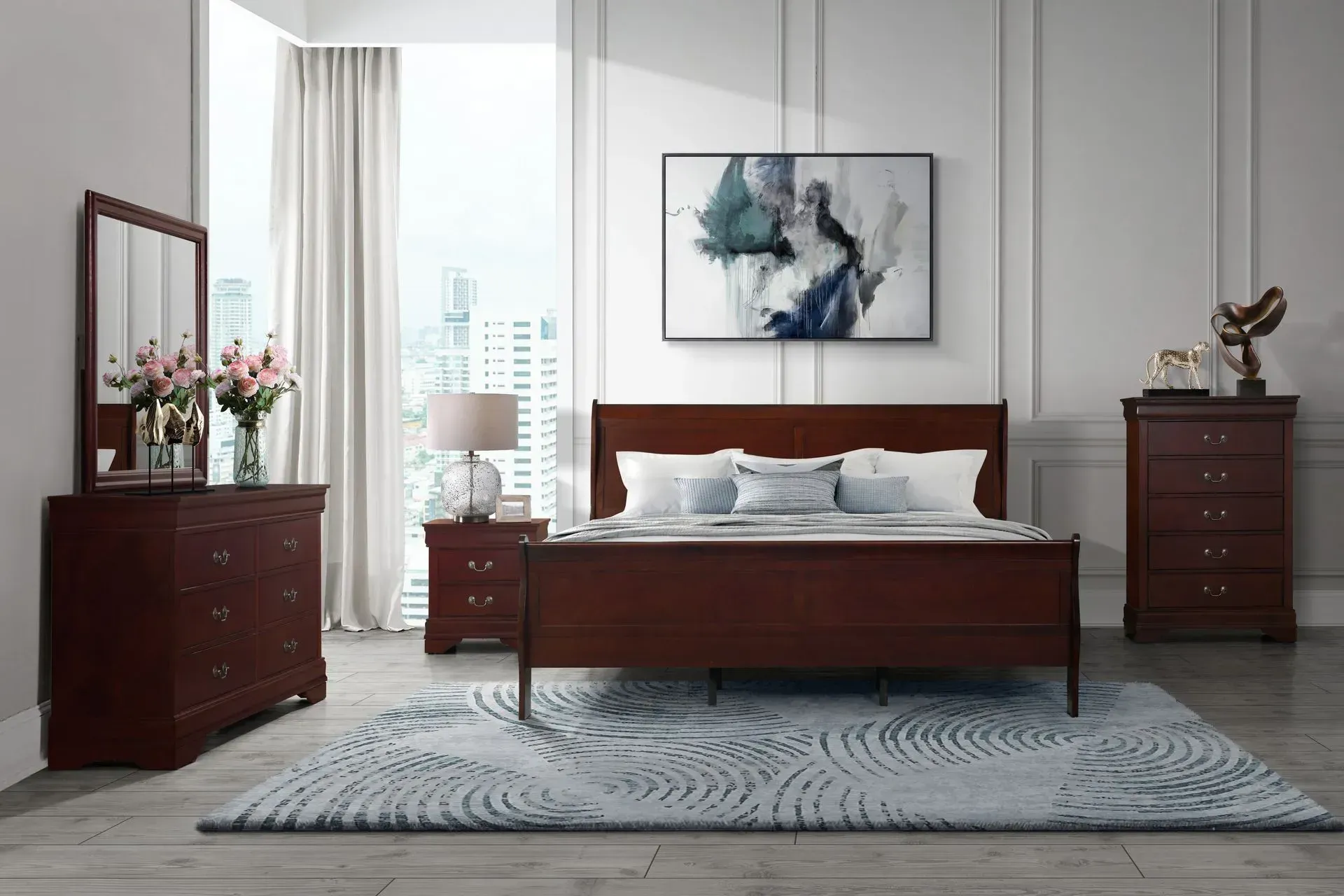 Bedroom set with a bed, dresser, nightstand, and chest of drawers in a room with a rug and a window.