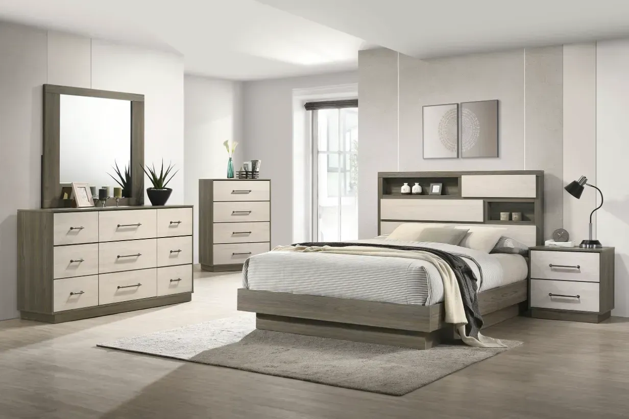 Bedroom furniture set: Light gray and cream bed, dresser, chest, nightstand, and mirror in a bright room.