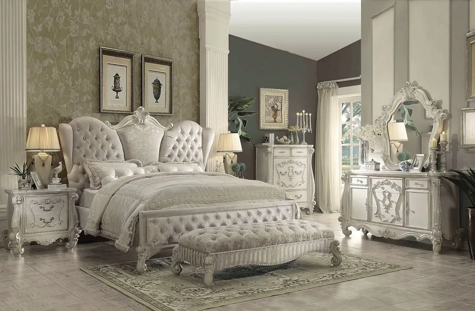 Ornate white bedroom set, including bed, nightstands, dresser, and bench; beige and gray color scheme.