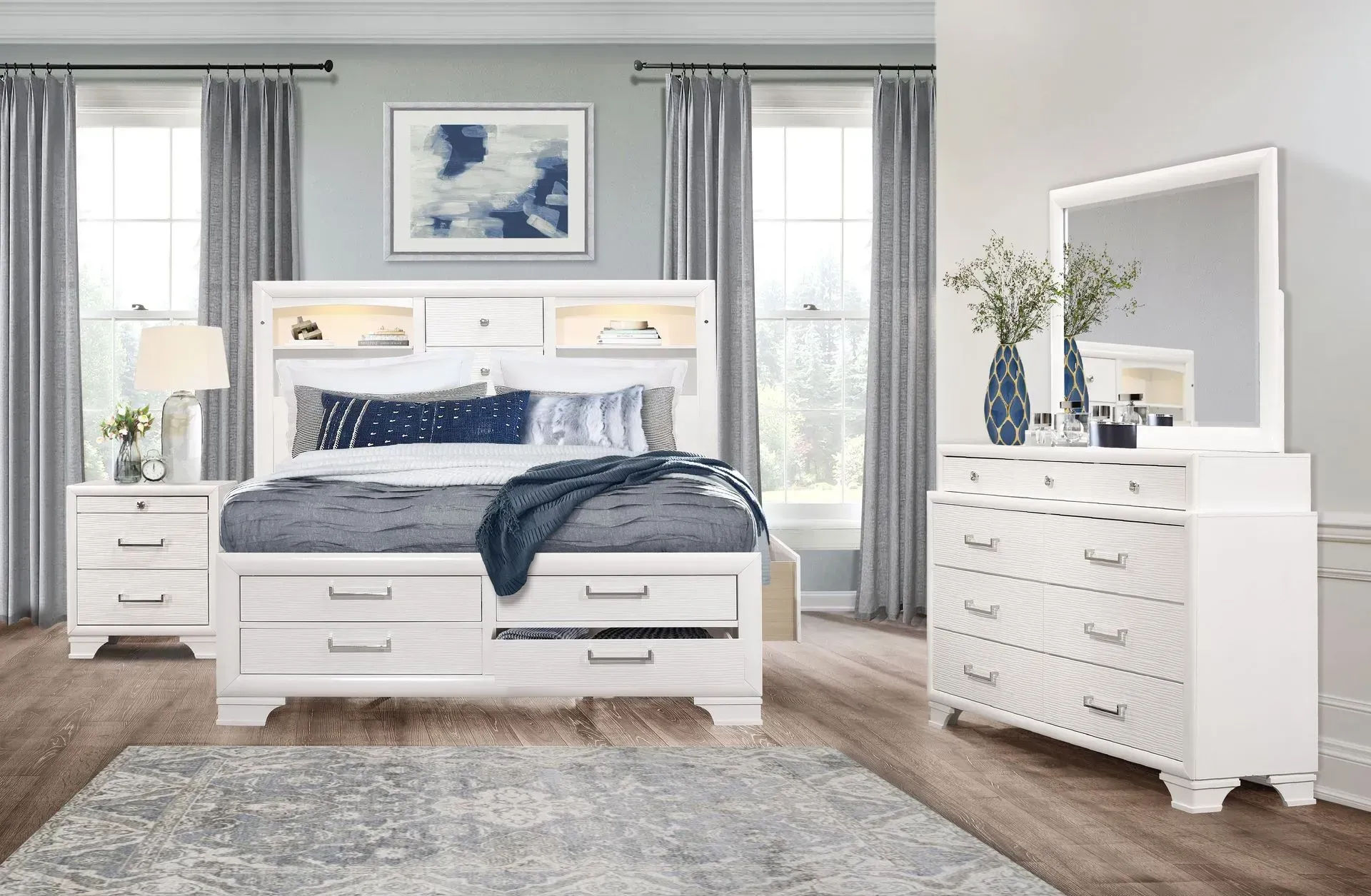 White bedroom furniture set with bed, nightstand, and dresser.
