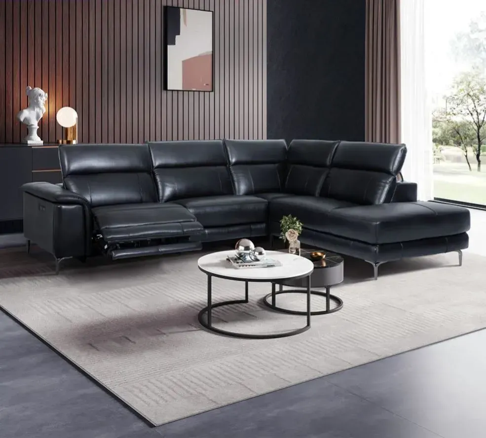 A living room with a sectional couch and a coffee table.