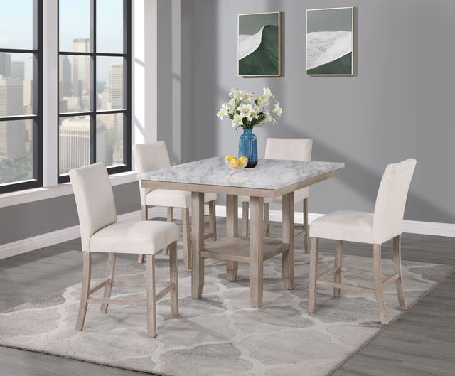 A dining room table and chairs with a vase of flowers on it