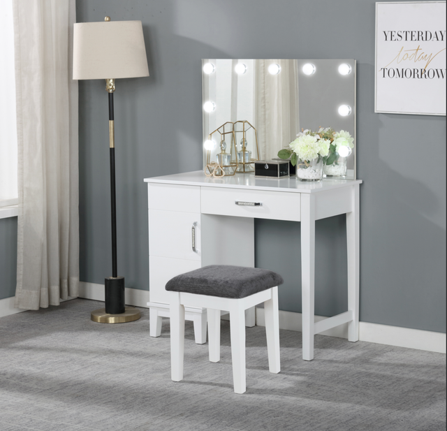 A vanity with a mirror and a sign that says yesterday today and tomorrow