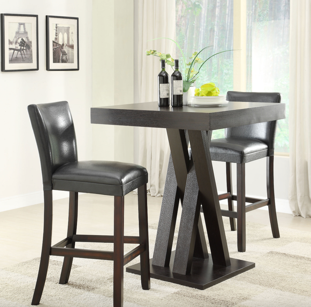 A table with two chairs and two bottles of wine on it