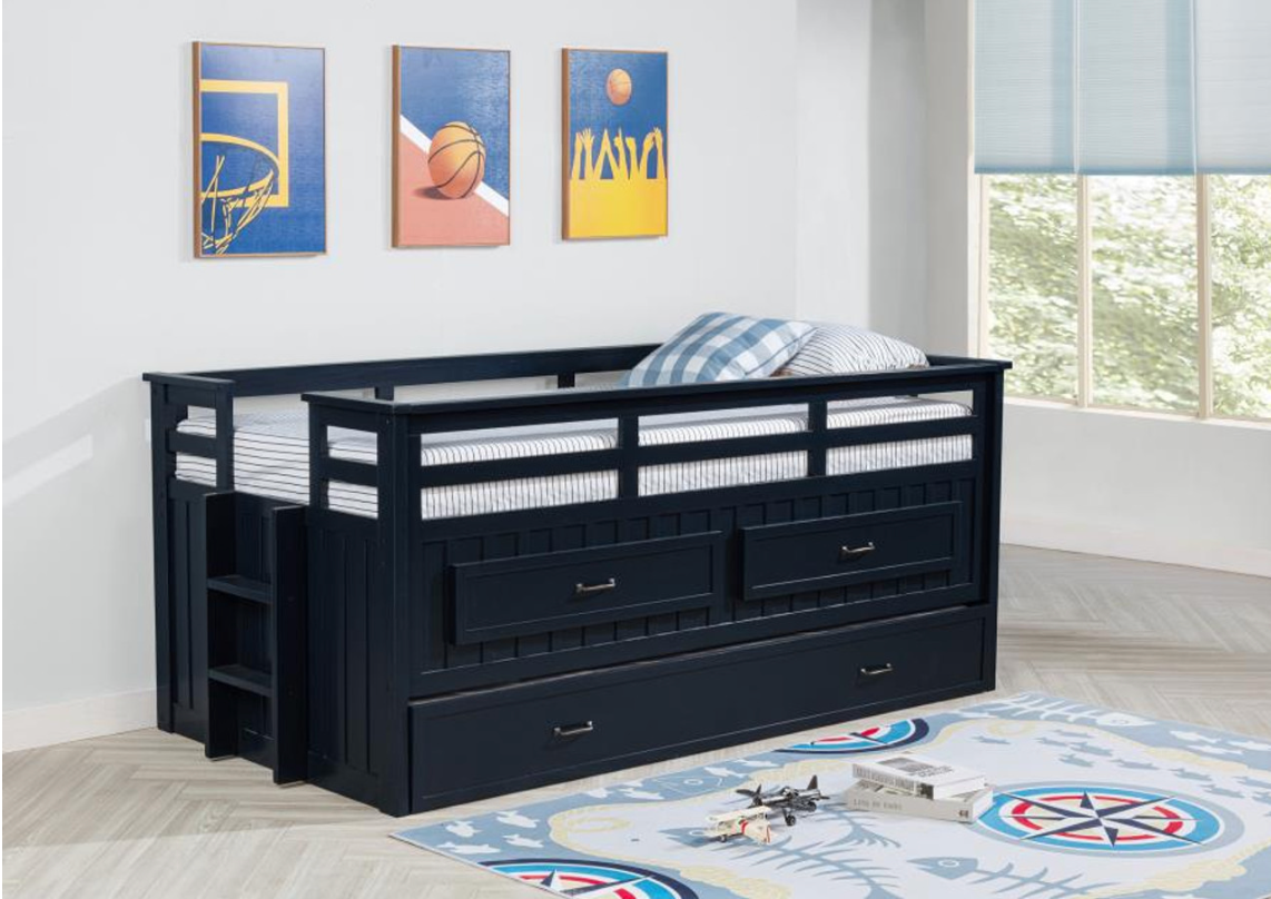 A bunk bed with stairs and drawers underneath it in a bedroom.